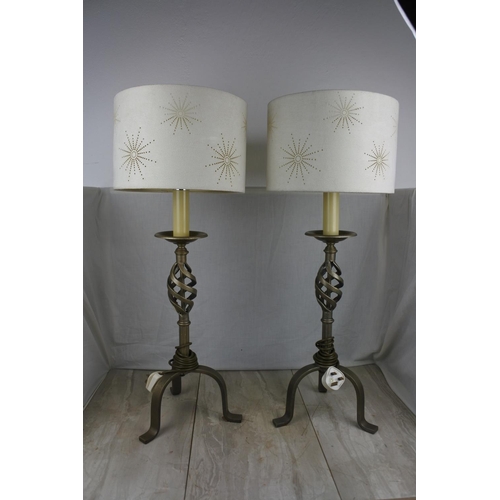 138 - A large pair of wrought iron base table lamps and shades, Approx 78cm in height.