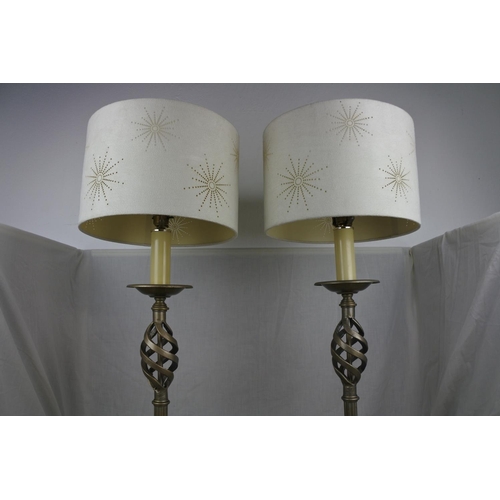 138 - A large pair of wrought iron base table lamps and shades, Approx 78cm in height.