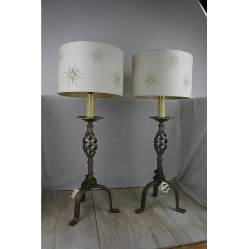 138 - A large pair of wrought iron base table lamps and shades, Approx 78cm in height.