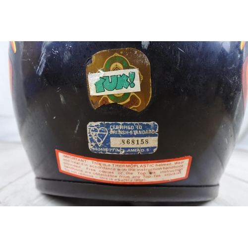 140 - A vintage motorcycle helmet.