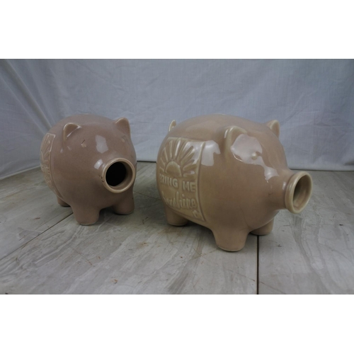 141 - Two 'Bring me Sunshine' ceramic pig money boxes.