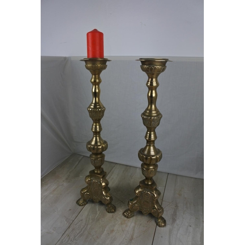 142 - A large pair of antique style ecclesiastical candlesticks, Each Approx 58cm in height.