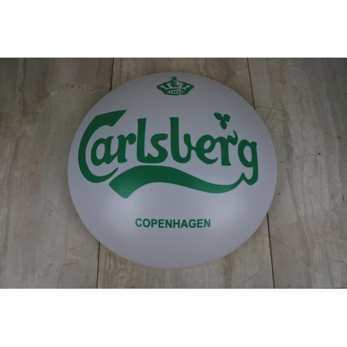 143 - A Carlsberg light cover, Approx 38cm in diameter.