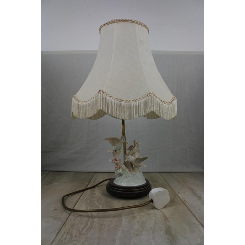 144 - A ceramic bird based table lamp and shade, Approx 42cm in Height.