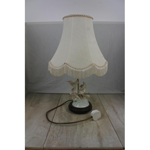 144 - A ceramic bird based table lamp and shade, Approx 42cm in Height.