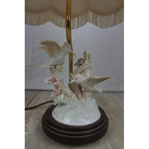 144 - A ceramic bird based table lamp and shade, Approx 42cm in Height.