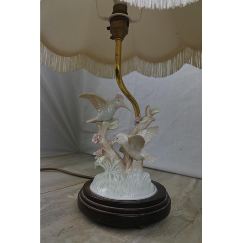 144 - A ceramic bird based table lamp and shade, Approx 42cm in Height.