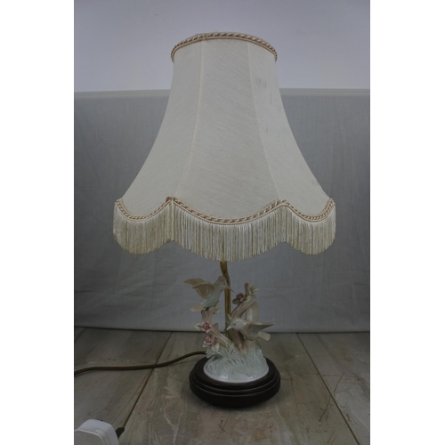 144 - A ceramic bird based table lamp and shade, Approx 42cm in Height.