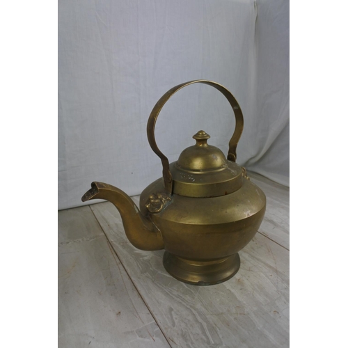 145 - A large brass kettle, Approx 22cm in height.