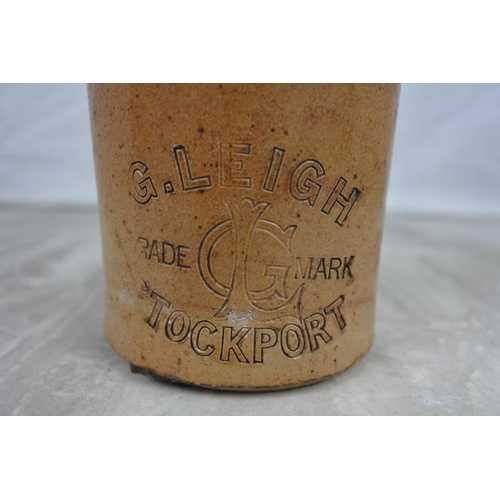 153 - An antique G Leigh, Stockport stoneware beer bottle.