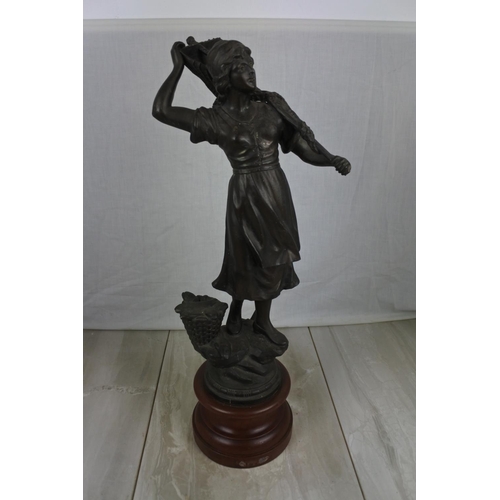 159 - A large spelter figure of a lady fishing on a wooden plinth, Approx 54cm in height.