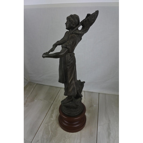 159 - A large spelter figure of a lady fishing on a wooden plinth, Approx 54cm in height.