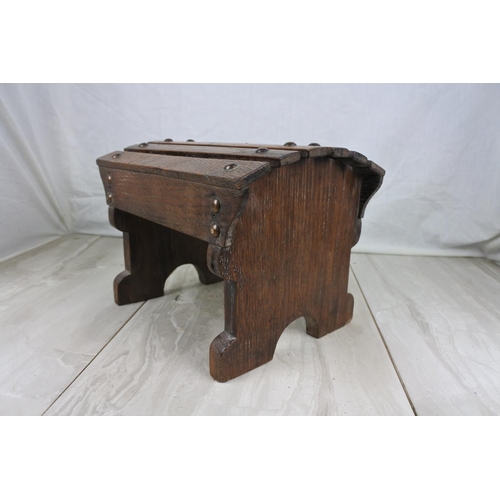 166 - A miniature arch topped oak stool, Approx 28x21x20cm.