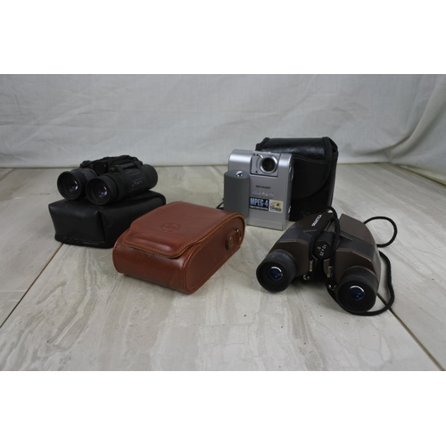 168 - A pair of cased Praktica Sport binoculars, a cased Sharp VNEZ1 camera and more.