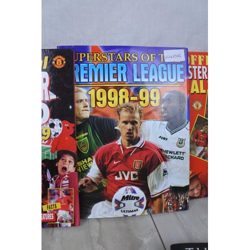 172 - A lot of Manchester United annuals and three Golfing themed books.