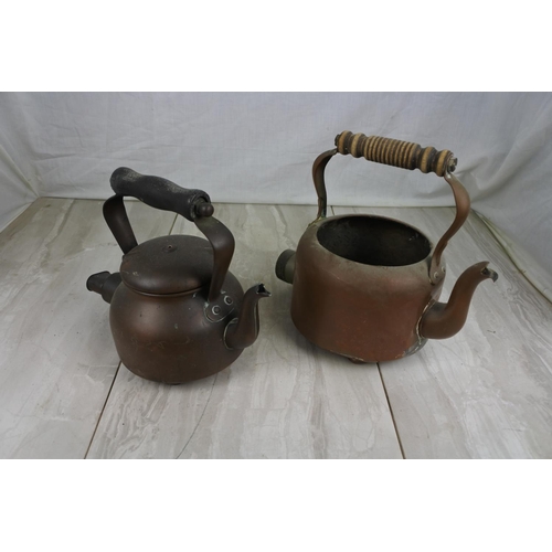 177 - Two antique copper kettles.