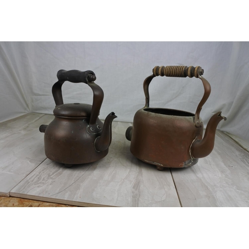 177 - Two antique copper kettles.