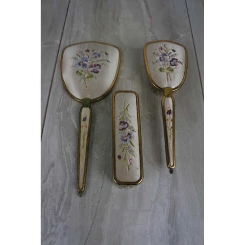 178 - A vintage three piece hand embroidered dressing table set.