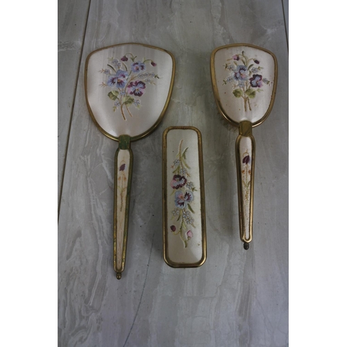 178 - A vintage three piece hand embroidered dressing table set.