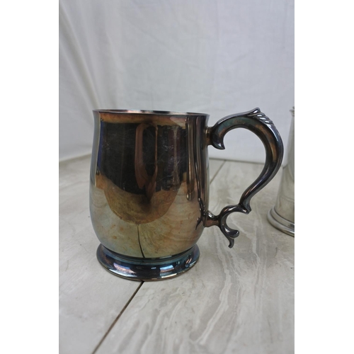 185 - An English Pewter lidded tankard and two others.