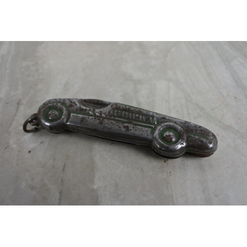 195 - An unusual penknife in the style of a racing car.