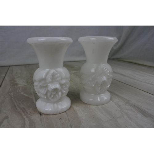 199 - A pair of vintage marble floral candlesticks, Approx 11cm in height.