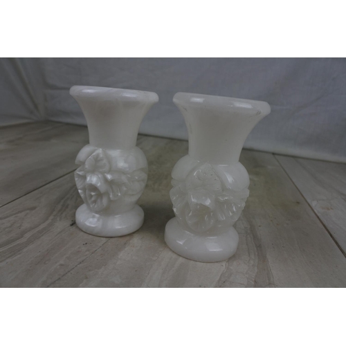 199 - A pair of vintage marble floral candlesticks, Approx 11cm in height.