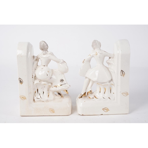 202 - A pair of ceramic bookends, Approx 16cm in height.