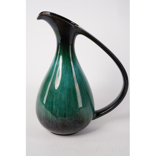 208 - A large vintage Blue Mountain pottery jug, Approx 32cm in height.