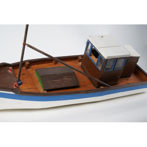 210 - A handmade wooden fishing boat, Approx 60cm in length.