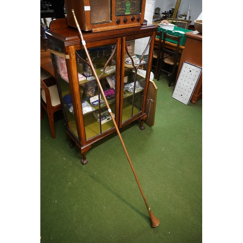 211 - An antique copper and brass horn, Approx 164cm in length.