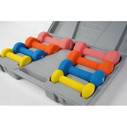 216 - A cased Mirafit dumbbell weight set.