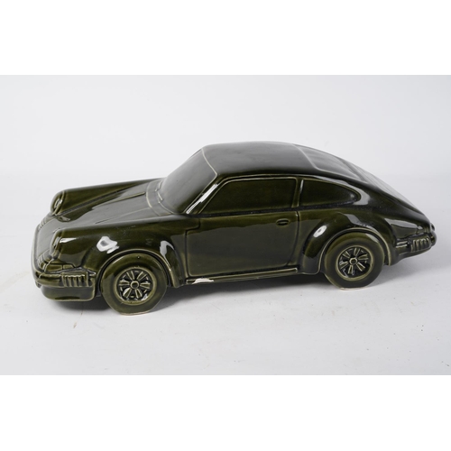 222 - A large ceramic model of a Porsche (A/F), Approx 36x15x12cm.