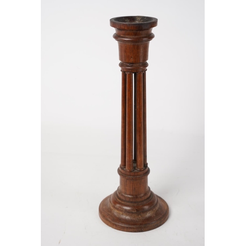 229 - A vintage wooden candlestick, Approx 30cm in height.