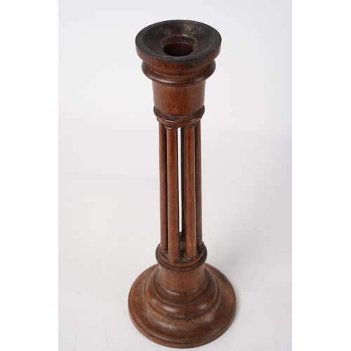 229 - A vintage wooden candlestick, Approx 30cm in height.