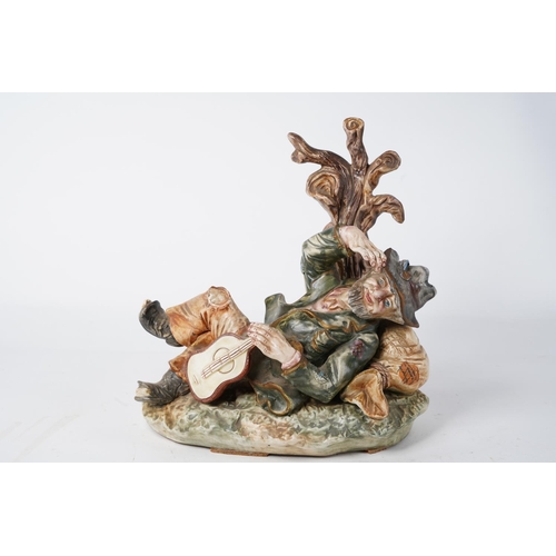 232 - A Capodimonte ceramic figure of a tramp with guitar (A/F), Approx 28cm in height.