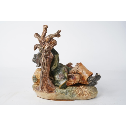 232 - A Capodimonte ceramic figure of a tramp with guitar (A/F), Approx 28cm in height.