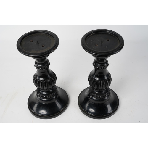 237 - A pair of decorative wooden candlesticks, Approx 24cm in height.