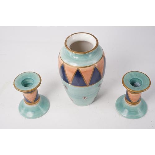 242 - A ceramic vase and matching candlesticks, 'Ports of Call' by Jeff Banks, London, Largest Approx 18cm... 