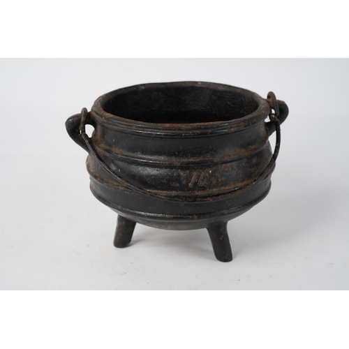 268 - A stunning Falkirk cast metal pot on three legs, Approx 12cm in diameter.