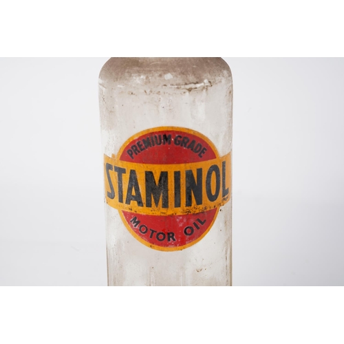 275 - A vintage Premium Grade Staminol motor oil glass bottle, Approx 29cm in height.