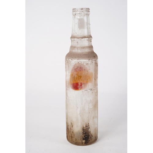 275 - A vintage Premium Grade Staminol motor oil glass bottle, Approx 29cm in height.