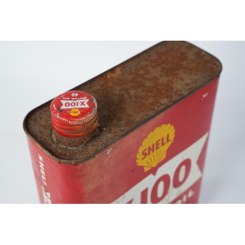 279 - A vintage Shell X-100 motor oil can with contents.