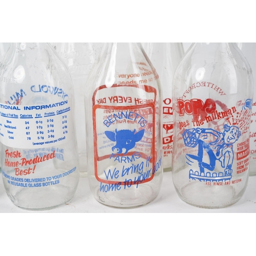 304 - A large assortment of vintage glass milk bottles.