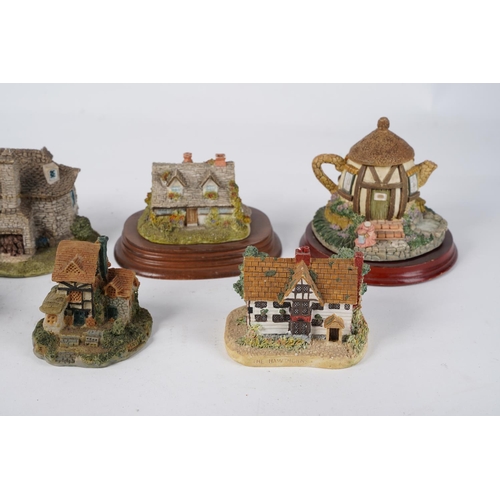 319 - A large lot of cottage ornaments by Loenardo, Academy, Minster giftware and more.