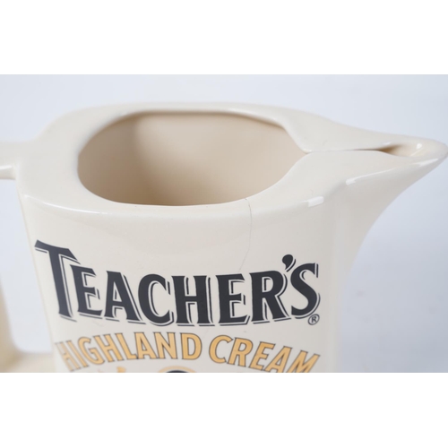 329 - A vintage Seaton Pottery 'Teacher's Highland Cream' Scotch Whisky jug (a/f).