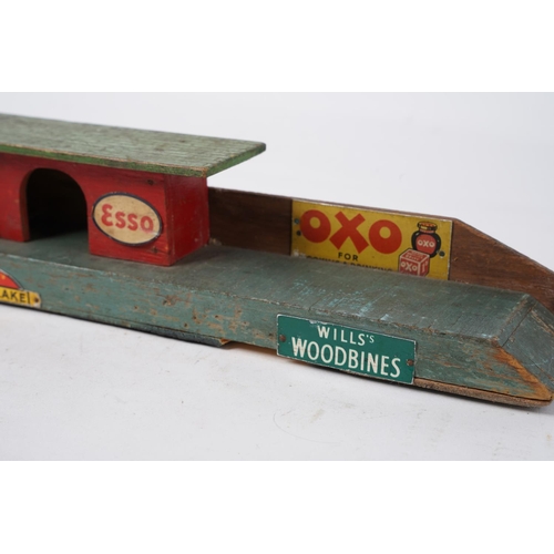 331 - A stunning vintage wooden toy platform with advertisements for Players, Esso, Will's Capstan and mor... 