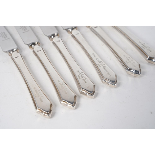 339 - A set of six Mappin & Webb sterling silver handled presentation knives.