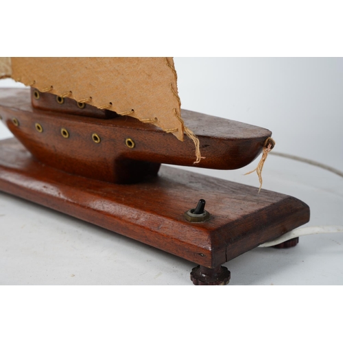 345 - A vintage electric light up wooden sailing ship.