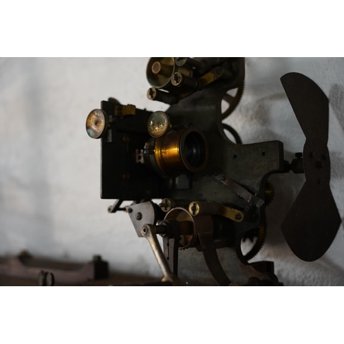 346 - A large antique cinema film projector.